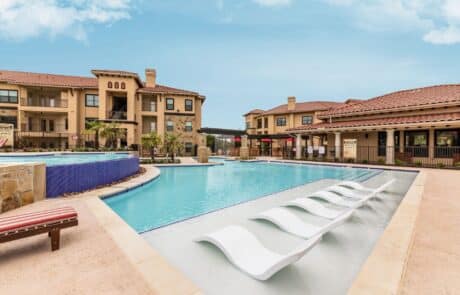 a two level outdoor pool at Creekside on Parmer Ln in TX