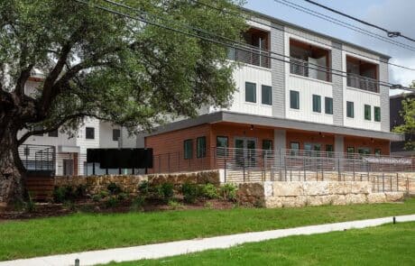 building facades in brown, grey, and white at Settler South Congress in Austin, TX